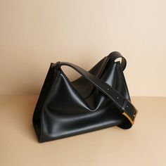 A relatively simple shaped leather shoulder bag. Vintage gold metal fittings and zippers create an elegant atmosphere. Made of soft cowhide leather, it feels good to the touch. There is a pocket inside. 
 
 
 Color 
 
 Black 
 Brown 
 
 
 Size 
 
 Height: 21cm 
 Width: 31cm 
 gusset: 13cm 
 Rise: 35-48cm 
 
 
 Material 
 
 Cowhide Luxury Leather Shoulder Bag With Rectangular Shape, Luxury Soft Leather Square Shoulder Bag, Luxury Sleek Bag With Smooth Grain, Luxury Textured Leather Square Shoulder Bag, Luxury Smooth Grain Shoulder Flap Bag, Luxury Square Soft Leather Shoulder Bag, Luxury Leather Flap Bag With Smooth Grain, Luxury Rectangular Shoulder Bag With Smooth Grain, Luxury Sleek Calf Leather Shoulder Bag