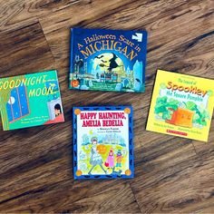 three children's books laid out on a wooden floor with the title halloween stories and goodnight good night moon