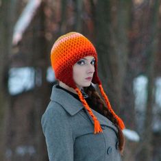 This warm orange hat is one of a kind. It has been crochet with two strands of yarn. This ensures that it is super thick and warm. It fades gracefully from bright orange to darker rusted oranges. It has triangular ear flaps with tie-able tassels. One size fits most. Hand wash and lay flat to dry. Yarn may vary slightly from photo. Wear it and make a statement! Great for supporting your favorite cozy season! It is double threaded and super warm. It has a lot of charm and spunk. Great for back to Handmade Orange Winter Hat, Orange Adjustable Beanie Hat, Adjustable Orange Beanie Hat, Adjustable Orange Beanie, Handmade Orange Beanie Hat, Orange Crochet Hat For Winter, Handmade Orange Crochet Beanie Hat, Orange Beanie For Winter, Orange Crochet Winter Hat