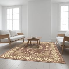 a living room with two couches, a coffee table and a rug on the floor