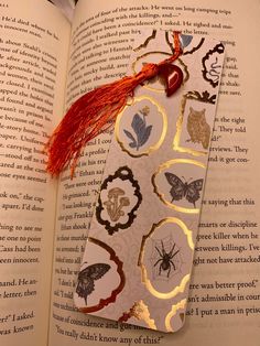 an open book with a red tassel on it