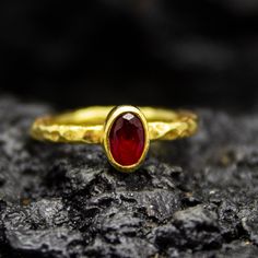 Tiny Gold Ruby Hammered Ring | Handmade Stackable Ring | 925 Silver 24K Gold Plated | Minimalist Dainty Jewelry | Simple Ring  Handcrafted hammered  Silver Ring Our shop offer free ring sizing and color options.(Oxidized(Black),Gold Plated) Metal : 925 Sterling Silver Plated : 24K Gold  Gemstone : Lab  Ruby Gem Size : 6 X 4 mm Band Size : 2 mm Ring Weight : 2.43 grams Ring Size : US 6 (The size you want is made for free). (We used the US standard sizing) Plating Options(FREE) : Gold,Silver  **Custom Orders is Made** As pellada family, we will be happy to help you if you contact us with the photo and dimensions of the design you want. To return back to Pellada Shop Home Page,Click here! https://www.etsy.com/shop/Pellada Thank you for shopping!          Pellada Hammered Silver Ring, Hammered Ring, Hammered Rings, Simple Ring, Jewelry Simple, Hammered Gold, Stackable Ring, Gold Plated Rings, Hammered Silver