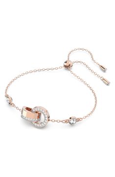 Twinkling glass crystals sparkle along the polished bands that center an elegant bracelet designed with an adjustable slide closure for the perfect fit. 2"-8" adjustable inner circumference Goldtone plate/glass Imported Luxury Adjustable Crystal Bracelet With Sparkling Stones, Luxury Adjustable Crystal Bracelet, Luxury Sparkling Adjustable Bracelet, Adjustable Rose Gold Crystal Bracelet For Formal Occasions, Adjustable Luxury Metal Crystal Bracelet, Luxury Adjustable Metal Crystal Bracelet, Sparkling Adjustable Crystal Bracelet For Formal Occasions, Formal Adjustable Sparkling Crystal Bracelet, Modern Adjustable Crystal Jewelry