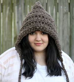 This chunky hooded hat in barley brown with braided ties makes the perfect winter accessory.  It is made of a soft mixture of lamb's wool and acrylic and is so nice and warm, it really goes great with any outfit.  If you would like this in a different color just choose your color from the color chart in the last picture and leave your selection in the notes to seller section during checkout.  Care:  Machine wash in cold, wrap in a towel and wring gently and lay flat to dry. Brown Outdoor Crochet Hat, Winter Brown Yarn Bonnet, Brown Yarn Bonnet Hat, Adjustable Cozy Brown Hat, Brown Handmade Crochet Hat For Outdoor, Crochet Hat Winter, Hooded Hat, Hat Crochet, Crochet Hat