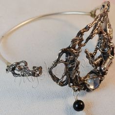 "This piece of sterling silver fantasy jewelry, it is truly a unique, mystical and beautiful artisans bracelet entitled \"The Quest Continues\". This mystical dragon and maiden bracelet depicts an encounter with a trio of faeries that will guide them on the next step of the journey. The roots of the ancient tree where the faeries live wrap around three stones; a 8mm rainbow moonstone, 5mm black spinel and 6mm labradorite. Dangling from a root are three stone beads, one each of labradorite, moons Adjustable Silver Jewelry For Fantasy Events, Elegant Silver Jewelry For Fantasy Events, Hand Cast Fantasy Sterling Silver Jewelry, Mystical Handmade Jewelry For Fantasy Events, Unique Metal Jewelry For Fantasy Events, Spiritual Hand Cast Jewelry Bracelet, Spiritual Hand Cast Bracelet Jewelry, Spiritual Hand-cast Bracelet Jewelry, Black Sterling Silver Fantasy Jewelry