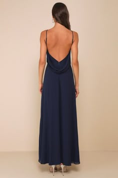 It's impossible to ignore the sultry allure of the Sophisticated Pose Navy Chiffon Boat Neck Backless Maxi Dress! Airy woven chiffon shapes this elegant dress that has adjustable spaghetti straps and a boat neckline, all atop a princess-seamed bodice. Turn around to reveal a stunning low back with a cowl detail. Fitted waist tops an A-line skirt that finishes at a maxi hem. Hidden zipper/clasp at back. Fit: This garment fits true to size. Length: Floor length. Size medium measures 58.5" from adj Prom Dresses Navy Blue Simple, Marine Dress Blue, Blue Long Backless Dress, Full Length Navy Blue Dress, Blue Formal Dress Simple, Bridesmaid Backless Dress, V Neck Blue Dress, Flowy Maxi Dress With Ruched Back For Party, Elegant Flowy Backless Dress For Party