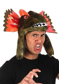 PRICES MAY VARY. 100% polyester fabric, 100% polyurethane foam Foam-backed velour head has appliqued facial features & teeth Hat lining has hook & loop fastener size adjustment band Lining has hidden pocket for ID & cash Neck drape has pocket for water bulb; tubing runs from bulb to character mouth Bring back the Jurassic Age of dinosaurs in this Dilophosaurus Spitting Water Costume Toy Hat. The fabric is textured to look like scales and the cowl and crests are holographic. This playful new addi Water Costume, Dinosaur Costumes, Kids Dinosaur Costume, Dino Costume, Dino Park, Dinosaur Hat, Inflatable Costumes, Dinosaur Costume, Dinosaur Eggs