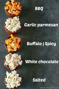 four bowls filled with different types of popcorn on top of a black table next to the words bbq garlic parmesan buffalo spicy white chocolate salted