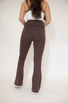 These Butter Foldover Flare Leggings are designed with comfort in mind. Made from super soft fabric, they feature a fold over waist for a snug fit and flared leggings that flatter your figure. Perfect for yoga, running or lounging. Model Info Model is 5’6 and wearing size: SMALL Model measurements: Bust: 32 in. Waist: 28.5 in. Hips: 38 in. Size Chart GENERAL SIZE CHART: 00-EXTRA SMALL, 0-2 SMALL, 4-6 MEDIUM, 8-10 LARGE, 12-14 EXTRA LARGE Each item runs differently therefore there is not a size c Solid Flare Yoga Pants For Loungewear, Stretch Full Length Yoga Pants For Lounging, Fitted Yoga Pants For Lounging, Fall Yoga Wide-leg Leggings, Full Length Yoga Pants For Fall Lounging, Brown High Stretch Full Length Yoga Pants, Brown Stretch Full-length Yoga Pants, High Stretch Full Length Brown Yoga Pants, Elastane Yoga Pants For Loungewear