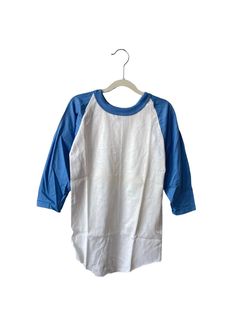 90s russell athletic baseball tee. deadstock. NWOT. white & columbia blue. 23" long. 13" across. 15.5" from neck seam to hem. shirt is unworn, has some yellowing on fold lines from prior storage. multiple colors, sizes & quantities available. made in USA. russell athletic founded in 1902. for the long run. legit. Vintage Baseball Tee, Baseball Tee Outfits, Genshin Outfits, Mens Grunge, Thrift Wishlist, Kid Outfit, Baseball Tee Shirts, 90s Baggy, 90s Shirts