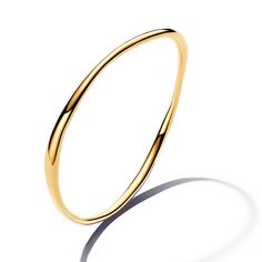 From Pandora, the Organically Shaped Bangle is a sleek style essential. This 14k gold-plated bangle features a wavy profile that varies in thickness, creating a sense of movement and a subtle undulating effect. Inspired by the natural lines and curves found in nature, this modern piece is effortlessly elegant. Stack this bangle up the arm with your other favorite bracelets and bangles, or let it stand alone as a lesson in simple beauty. Pandora Style #: 563317C00-2 Classic Yellow Gold Bangle With Oyster Detail, Minimalist Curved Gold Jewelry, Sleek Polished Bangle Jewelry, Sleek Polished Bangle Bracelet, Modern Hoop Gold Bracelet For Formal Events, Modern Gold Hoop Bracelet For Formal Occasions, Gold Curved Jewelry With A Modern Twist, Gold Jewelry With A Modern Curved Design, Modern Yellow Gold Bangle With Polished Finish