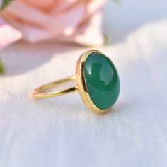 D E T A I L S - Material: 925 Sterling silver Stone: Green Onyx The fit: True to US ring size Finish: Smooth and Gold Plated to a high shine S H I P P I N G & P R O D U C T I O N - My current production time is 2-6 business days, which means after those days are up, your order ships! I make everything custom to order, by hand, but I promise you it's worth the wait! R U S H - M Y - O R D E R - If you're in a rush to get your pretty new pieces, please send me a message and I'll let you know ju Oval Cabochon Rings For May Birthstone, Oval Emerald Ring With Polished Finish, May Birthstone Rings In Oval Cabochon Shape, May Birthstone Oval Cabochon Rings For Gift, Classic Green Oval Stackable Rings, Oval Dome Ring With Bezel Setting As Gift, Oval Dome Ring With Bezel Setting For Gift, Oval Dome Ring With Bezel Setting, Aqua Chalcedony Ring