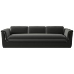 a black couch sitting on top of a white floor