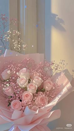 a bouquet of pink roses in front of a mirror