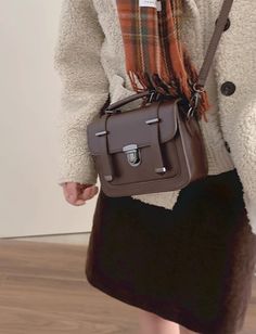 Faux leather boxy satchel bag with a press-down buckle, zip-up main compartment, adjustable crossbody strap and handle. 16cm x 20cm x 7cm / 6.3" x 7.9" x 2.75" Fall Satchel With Hasp Closure For Everyday Use, Rectangular Satchel With Hasp Closure For Fall, Rectangular Saddle Bag With Buckle Closure For Everyday Use, Satchel With Buckle Closure For Daily Use, Square Satchel With Hasp Closure For School, Leather Box Bag With Detachable Strap For School, School Leather Box Bag With Detachable Strap, Square Box Bag With Detachable Strap For School, Leather Crossbody Box Bag For School