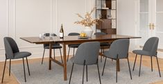 a dining room table with chairs around it