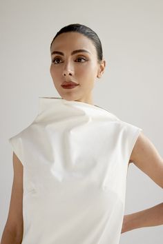 Structured fabric with fitted or relaxed silhouette Funnel collar and high-low hem Back zip fastening Model wears size S Model is 172cm/5'8" with 26 waist, 36 bust, 34 hips 100% viscoseMade with 100% eco-friendly and biodegradable pure cottonDry Clean OnlyMade in Armenia Luxury Chic Cap Sleeve Dresses, Structured Fashion, Structured Fabric, Happy Clothes, White Caps, Armenia, High Low Hem, S Models, Short Dress