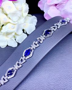 "A DREAM COMES TRUE! Gorgeous masterpiece! ONE OF A KIND Bracelet! Featuring 4 pieces of extra fine, SPARKLING CEYLON BLUE SAPPHIRES weighting a total of 9.93 carats... and 263 pieces of BIG SPARKLING, top-grade, F/VS, round and baguette Diamonds (3.32 carat in total). SET IN ONE-OF-A-KIND 18K Solid White Gold, meticulously designed and handcrafted BRACELET! A true heirloom piece that can transcend beyond times and eras.... BRAND NEW, HANDMADE BY OUR GOLDSMITHS! DAZZLING GENUINE CEYLON BLUE SAPP Luxury Blue Diamond Bracelet For Formal Events, Luxury Blue Diamond Bracelet For Formal Occasions, Luxury Sapphire Tennis Bracelet, Luxury Blue Diamond Bracelet, Luxury Sapphire Diamond Bracelet For Formal Events, Luxury Oval Diamond Bracelet With Gemstone, Luxury Sapphire Diamond Bracelet For Formal Occasions, Blue Brilliant Cut Diamond Bracelet For Wedding, Luxury Blue Oval Diamond Bracelet