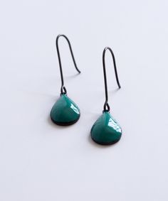 Teal and black dangle earrings Dangling Earrings Aesthetic, Enamel Teardrop Jewelry With Matching Earrings, Green Teardrop Enamel Jewelry, Single Green Enamel Earring, Green Enamel Single Earring, Green Nickel-free Teardrop Drop Earrings, Green Nickel-free Teardrop Earrings, Green Teardrop Drop Earrings Nickel Free, Green Modern Teardrop Jewelry