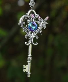 This magical silver plated fairy key necklace is a well kept secret among the fae folk as it opens the lock to the fairy world and beyond.  Experience the mischief of owning this large fantasy key which features a captivating Swarovski crystal and a cute little fairy who closely guards it. Swarovski brand crystals are known for their brilliant sparkle and precision craftmanship making them the highest quality crystal in the world! The key pendant measures 3" x 1 1/2" (7.62cm x 3cm) and the chain Old Keys, Key Jewelry, Keys Art, Magical Jewelry, Key To My Heart, Key Necklace, Key Pendant, Fantasy Jewelry, Pretty Jewellery