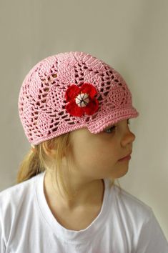 Stylish lace kids summer visor hat or cap is crocheted from beautiful pink  100% cotton yarn. This is a great hat for spring and summer, protecting your toddler head for sun. Girls sun hat is decorated with red crocheted poppy flower.Size: kids, toddlers (ages 2 - 6)Hight: 15 cm( about 6")Head circumference 20-20,5" (around 50-52 cm)Little bit strchy.Care: Hand wash in cool water. Lay flat to dry. Reshape while damp. No dryer!Ready to ship. Spring Crochet Cap Sun Hat, Spring Crochet Sun Hat Cap, Cute Pink Crochet Hat For Beach, Pink Crochet Sun Hat For Spring, Crochet Cotton Yarn Sun Hat Cap, Cute Brimmed Crochet Hat For Spring, Adjustable Pink Cotton Crochet Hat, Pink Crochet Hats For Spring, Pink Yarn Crochet Hat For Gift