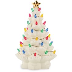 a white ceramic christmas tree with multi - colored lights