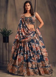 Be the center of attention with this Dove Blue Floral Digital Printed Embroidered Organza Bridal Lehenga Choli! Perfect for USA women's weddings, this ready-to-wear Indian Chaniya Choli will make you feel like royalty with its elegant design and stunning floral print. Look and feel your best on your special day with this must-have bridal ensemble. The unstitched blouse can be customized upto 46 inches. Do Note: All the accessories shown are for styling purpose only. Slight color variation may oc Lehenga Choli Designs, Indian Wedding Lehenga, Choli For Women, Lehenga Choli Wedding, Floral Lehenga, Organza Lehenga, Bollywood Lehenga, Lengha Choli, Blue Lehenga