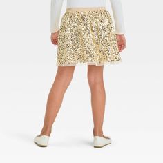 Spruce up their fancy wardrobe with this Sequin Party Skirt from Cat & Jack™. The above-knee party skirt is crafted from recycled polyester mesh fabric with a full lining and full elastic waistband for a comfortable fit. It features an allover sparkly sequin design in gold, making it a great pairing with any of their favorite party tops. Cat & Jack™: Designed for all children so you can trust it's made for yours. Stretch Tulle Bottoms For Party, Spring Party Skirt With Elastic Waistband, Playful Fitted Party Bottoms, Fitted Party Skirt With Elastic Waistband, Fitted Skirt With Elastic Waistband For Party, Playful Spring Tulle Skirt, Fitted Tulle Skirt For Dress-up, Holiday Stretch Mini Skirt, Stretch Mini Skirt For The Holiday Season