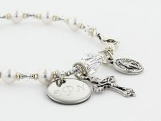 "A personalized bridesmaid gift to say \"Thank You So Much.\" Each bracelet can have it's own personalized disc! It can represent a one decade rosary or just be a very stylish bracelet (I can remove the crucifix and medal). It comes with a Crucifix and a Miraculous Medal dangling near the clasp. It is available with or without an Engraved Disc and it comes with your choice of a Gift Message that is elegantly boxed for simple gift giving. The ornate and delicate Rosary Bracelet is handcrafted wit Elegant Engraved Name Bracelet For Bridesmaid, Elegant Name Bracelet For Bridesmaid Gift, White Sterling Silver Crystal Bracelet For Wedding, Elegant White Name Bracelet For Bridesmaid Gift, Hypoallergenic Beaded Bracelets For Weddings, Hypoallergenic Beaded Bracelet For Weddings, Adjustable Engraved Name Bracelet For Bridesmaid Gift, Silver Personalized Bracelets For Bridesmaid Gift, Personalized Beaded Wedding Bracelets