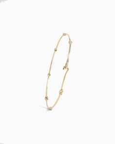 The Dainty Diamond & Petroglyph Hook Bracelet, handcrafted in gently hammered 14K solid gold, showcases tiny replicas of the iconic St. John petroglyph and faceted diamonds along the band. Secured with a dainty hook clasp, this bracelet seamlessly blends versatility and style, making it the perfect choice to wear solo or stacked with other favorites. Metal: 14K solid gold Stones: Diamond Band Width: 1.5mm Stone Size: 2mm Style #: GB119D Hook Bracelet, Hook Clasp, Diamond Band, Diamond Bands, St John, Solid Gold, Diamonds, Bracelet, Band