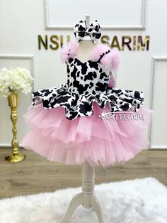 Are you looking for a one-of-a-kind dress that perfectly captures your little girl's playful spirit and individuality? Look no further! Our knee-length, flared cow-themed dress is a delightful choice for your young fashionista. This whimsical cow-themed dress is designed to enchant and delight girls who love unique fashion. The dress features a charming pattern of cow spots, creating an adorable and playful look. The knee-length design is both stylish and comfortable, allowing your child to move Cow Birthday Party Outfit, Barnyard Theme, 1st Birthday Dress, Cow Costume, 1st Birthday Dresses, Cow Spots, Cow Birthday, Girl Birthday Themes, Cowgirl Birthday