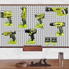 a pegboard with various tools on it and some screwdrivers in the background