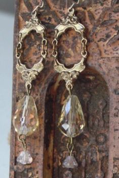 These are fit for a princess.  I've taken vintage brass findings and attached a soft gold glass briollette with a pink tulip glass bead dangling below.  They hang 2 1/2 inches from the brass kidney ear wire. They are very sweet and should remind you that you are a princess. Happy Shopping~ To continue~ https://www.etsy.com/shop/Heartpocketjewelry?ref=hdr_shop_menu To get regular updates of my jewelry~ www.Facebook.com/loveheartpocket Diy Victorian Jewelry, Vintage Teardrop Crystal Earrings For Formal Occasions, Vintage Teardrop Pierced Earrings, Vintage Crystal Teardrop Earrings For Formal Occasions, Vintage Drop Earrings With Matching Set, Vintage Drop Jewelry Set With Matching Earrings, Vintage Drop Earrings For Pierced Ears, Antique Brass Chandelier Earrings, Vintage Pierced Dangle Chandelier Earrings