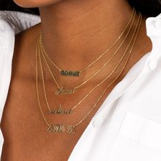 Flaunt the carefree side of your personal style with Adina's Flat Bubble Name Necklace, featuring a flattened, bubble-font nameplate that dangles from a slim chain. Customize this beauty with the word or name of your choosing. It makes quite the statement on its own but really brings on the "wow" factor when you wear it with another personalized necklace and a couple of chokers. Product Details Made from Sterling Silver Gold Plated Nameplate Size: 6 MM X 22 MM Length: 17"+ 2" This Product Requir Nameplate Necklace Gold, Chain Ideas, Bubble Font, Necklace Stack, Nameplate Necklace, Plate Necklace, Cluster Necklace, Graffiti Styles, Script Font