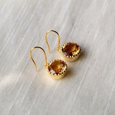 This beautiful pair of Earring has Citrine embedded in 925 sterling silver, and Gold Plated to a high shine. This pair matches with your every outfit to give you a classy and elegant look. Upgrade your accessory collection today with this must have piece today. D E T A I L S - material : sterling silver stone : Citrine polish : gold polished finish : smooth and polished to a high shine S H I P P I N G & P R O D U C T I O N - My current production time is 2-6 business days, which means after Luxury Citrine Earrings, Polished Finish Drop Earrings For Wedding, White Gold Gemstone Drop Earrings, Sterling Silver Bridal Earrings In Yellow Gold For Gift, Wedding Drop Earrings With Polished Finish, Silver Dainty Earrings With Polished Finish, Luxury Crystal Earrings For Pierced Ears As Gift, Polished Sterling Silver Earrings As A Gift, Dainty Silver Earrings With Polished Finish