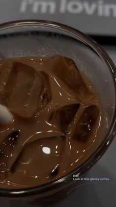 a glass bowl filled with ice cream and chocolate