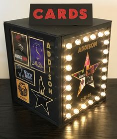 a light up box that has some lights on it and the words cards above it