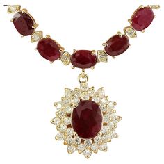 46.40 Carat Natural Ruby 14 Karat Solid Yellow Gold Diamond Necklace Stamped: 14K Total Necklace Weight: 30.8 Grams Necklace Length: 18.5 Inches Center Ruby Weight: 2.20 Carat (10.00x8.00 Millimeters) Side Ruby Weight: 41.00 Carat (6.00x4.00 Millimeters) Diamond Weight: 2.30 Carat (F-G Color, VS2-SI1 Clarity) Face Measures: 20.70x19.20 Millimeter SKU: [600425] Ruby Diamond Necklace, Gold Diamond Necklace, La Face, Ruby Diamond, Natural Ruby, Solid Yellow, Gold Diamond, Jewelry Necklace Pendant, Diamond Necklace