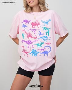 This Unisex garment-dyed t-shirt features a grunge set of dinosaur illustrations in a pastel color palette. It is the perfect gift for dinosaur lovers, present / future paleontologists, and more! Make sure to check out the other garment options below :) » O P T I O N S « ‣ Crewneck: https://www.etsy.com/listing/1221165814 » A B O U T « ‣ This item is made to order using direct-to-garment (DTG) printing technology. This digital process involves the printer inks being jetted or sprayed onto the te 90s Grunge Clothing, Indie Graphic Tees, Dinosaur Tshirt, Universal Parks, Pastel Goth Outfits, Cute Dino, Goth Clothes, Grunge Clothing, Dinosaur Illustration