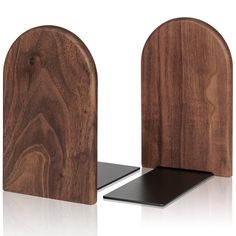 two wooden bookends with black metal bases