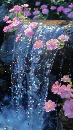 flowers are floating in the water next to a waterfall