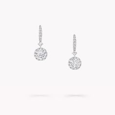 From the Classic Graff collection, our Icon earrings are quintessential Graff. Showcasing two round brilliant diamonds, the centre stones are orbited by halos of pavé diamonds, augmenting their brilliance. Suspended from a precise line of pavé diamonds, set upon delicately crafted white gold French wire, the slender setting and halo effect of the diamond drops serve to amplify their brilliance: the ultimate display of virtuosity, captured in a timelessly elegant design. Model wears an elegant pa Graff Jewelry, Icon Jewelry, Graff Diamonds, Round Diamond Pendant, Round Diamond Earrings, White Diamond Earrings, Diamond Earrings Studs Round, Fine Diamond Jewelry, Platinum Jewelry