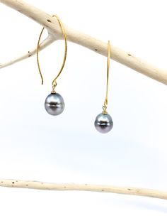 This is a simple, classic earring with a beautiful pair of Tahitian pearls. No two Tahitian pearls are alike, so matching them into pairs is a challenging task. In addition to the shape, the color tone of the pearl's surface varies in each one because they are naturally colored, non-died pearls. The hook-shaped ear wire is made of vermeil and about 1.5 inches/ 4 cm in length. There is a shorter hook version of this style available as well in the listings. Total length : 2 inches / 5 cm Tahitian Luxury Tahitian Pearl Jewelry For Wedding, Luxury Tahitian Pearl Earrings, Tahitian Pearl Dangle Earrings Gift, Classic Tahitian Pearl Earrings, Classic Tahitian Pearl Earrings As Gift, Classic Gold Tahitian Pearl Earrings, Classic Tahitian Pearl Earrings For Gift, Classic Tahitian Pearl Drop Jewelry, Classic Tahitian Pearl Drop Earrings