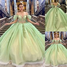 a woman in a green ball gown standing on stairs