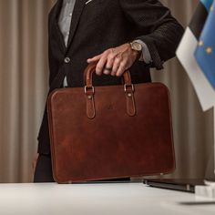 The Elegant laptop bag seamlessly blends the practicality of a modern laptop bag with the classic appeal of a timeless leather briefcase. It's the perfect choice for professionals who prioritize both their work and style. Laptop Bags For Men Style, Minimalist Laptop Bag, Elegant Laptop Bag, Male Office