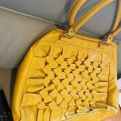 Material:Faux Leather Color :Yellow Mustard Closure:Zipper Internal Linning Purple Satin Internal Zip Pocket Size:12”X15” Ruffle Weave Pattern On Front Excellent Condition Like New Never Used Yellow Rectangular Shoulder Bag With Zipper Closure, Yellow Satchel With Zipper Closure, Rectangular Yellow Shoulder Bag With Zipper Closure, Yellow Satchel Shoulder Bag With Zipper Closure, Yellow Retro Shoulder Bag For Shopping, Retro Yellow Shoulder Bag For Shopping, Trendy Yellow Satchel With Zipper Closure, Trendy Mustard Shoulder Bag, Trendy Yellow Satchel For Shopping