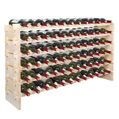 a wooden wine rack filled with lots of bottles on top of eachother in front of a white background