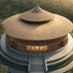 an aerial view of a circular building with stairs leading up to it