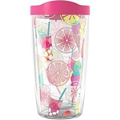 the tumbler cup is decorated with colorful fruit and candy on it's side