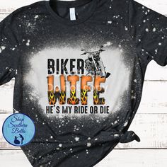 a black shirt with the words biker bite he's my ride or die on it